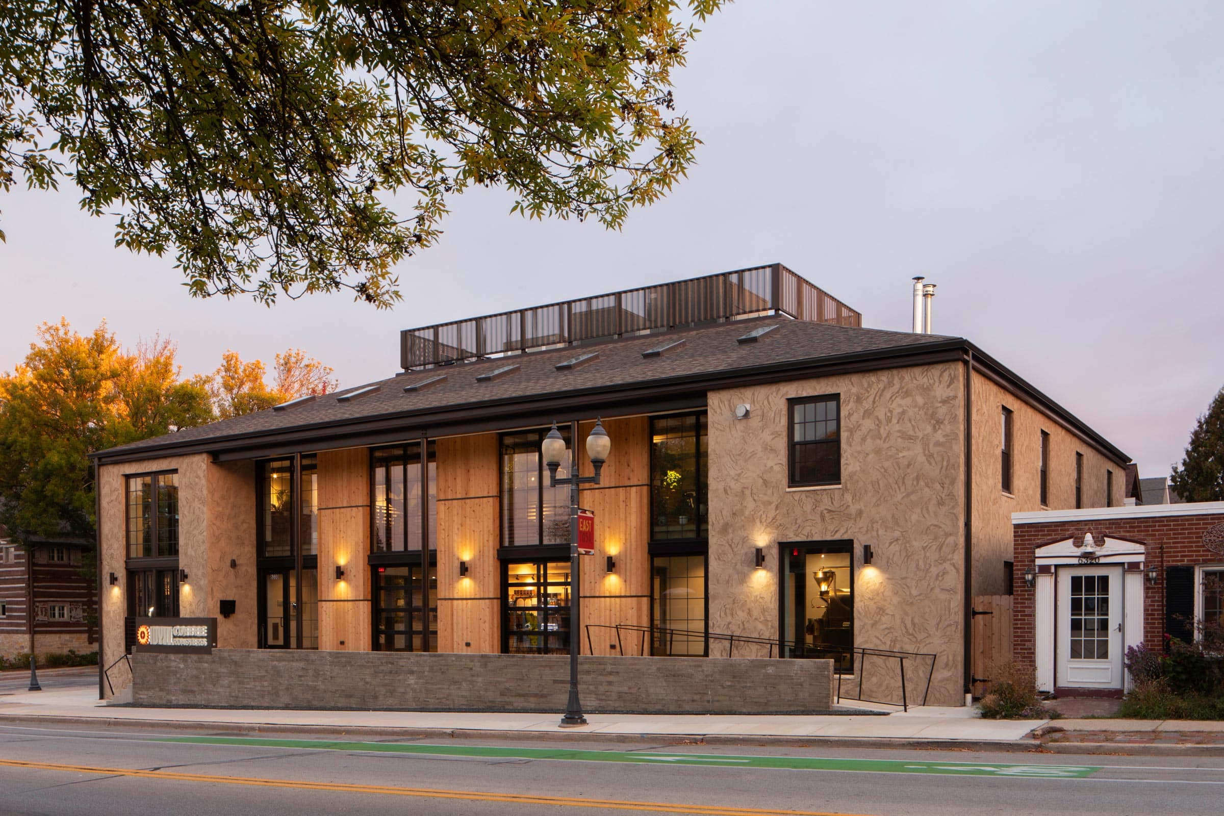 Idyll Coffee Roasters exterior at dusk on North Avenue with warm interior light.